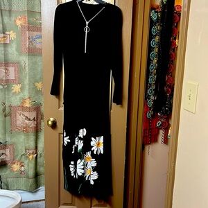 Long sleeve black dress with flowers on the skirt